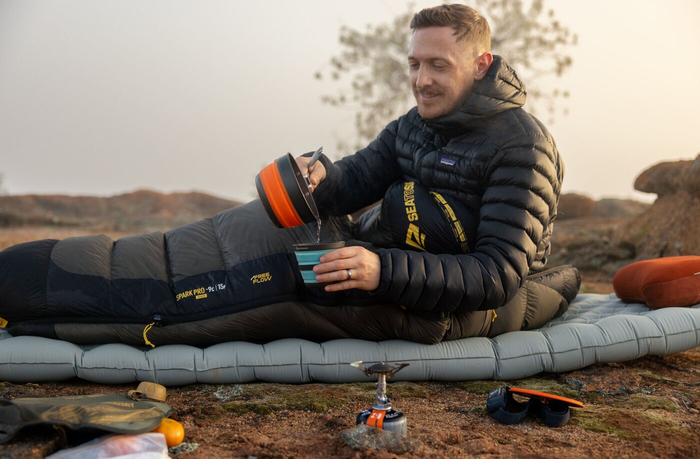 Pouring coffee at camp during a bikepacking trip
